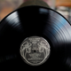 A man shows a vinyl record at "El Pollo Musical" (The Musical Chicken) record store in San Salvador